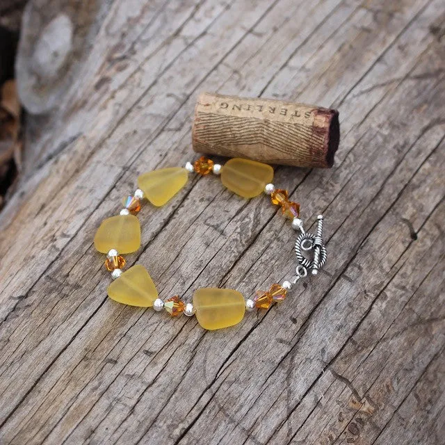 Amber-colored sea glass bracelet with Swarovski crystals and sterling silver