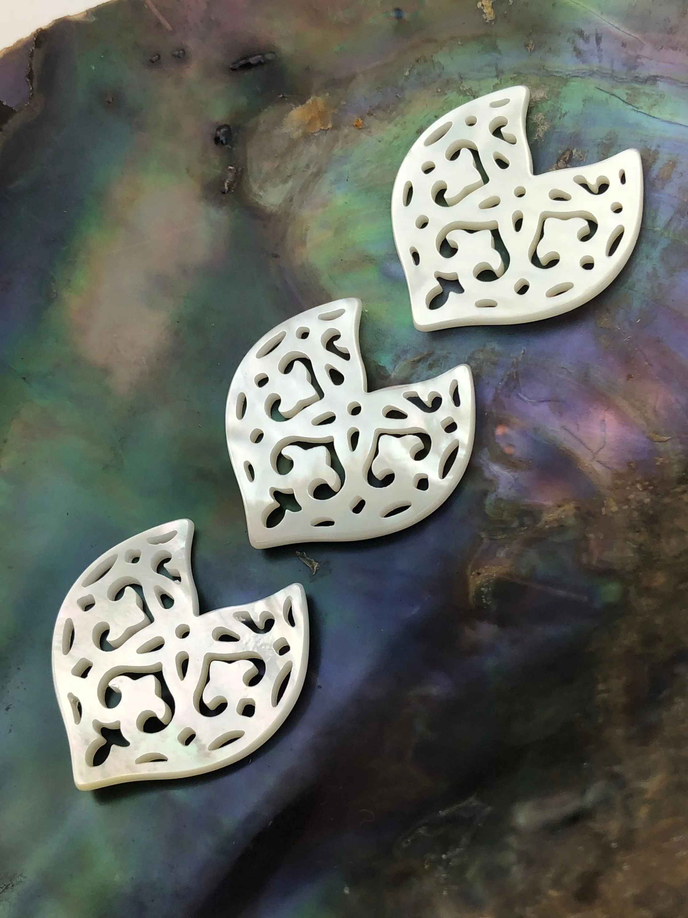 White carved Mother of Pearl Dolphin Tail